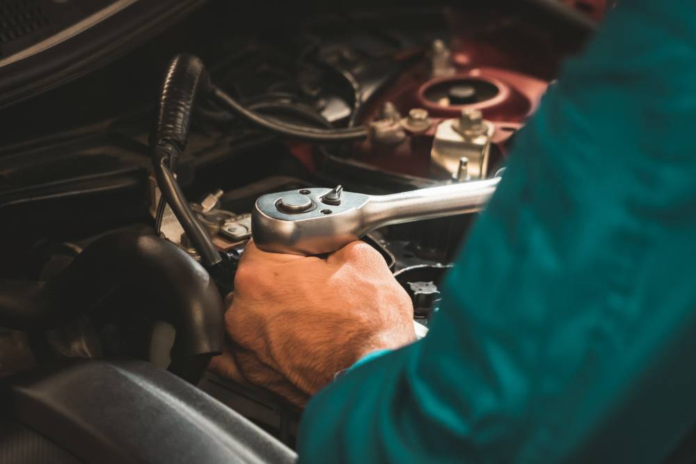 Automobile Repairs Mechanics checking and repairing the car. Car auto services concepts